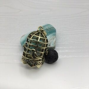 Cage w/Bird Aromatherapy Brass tone Locket.  Lava stone included.